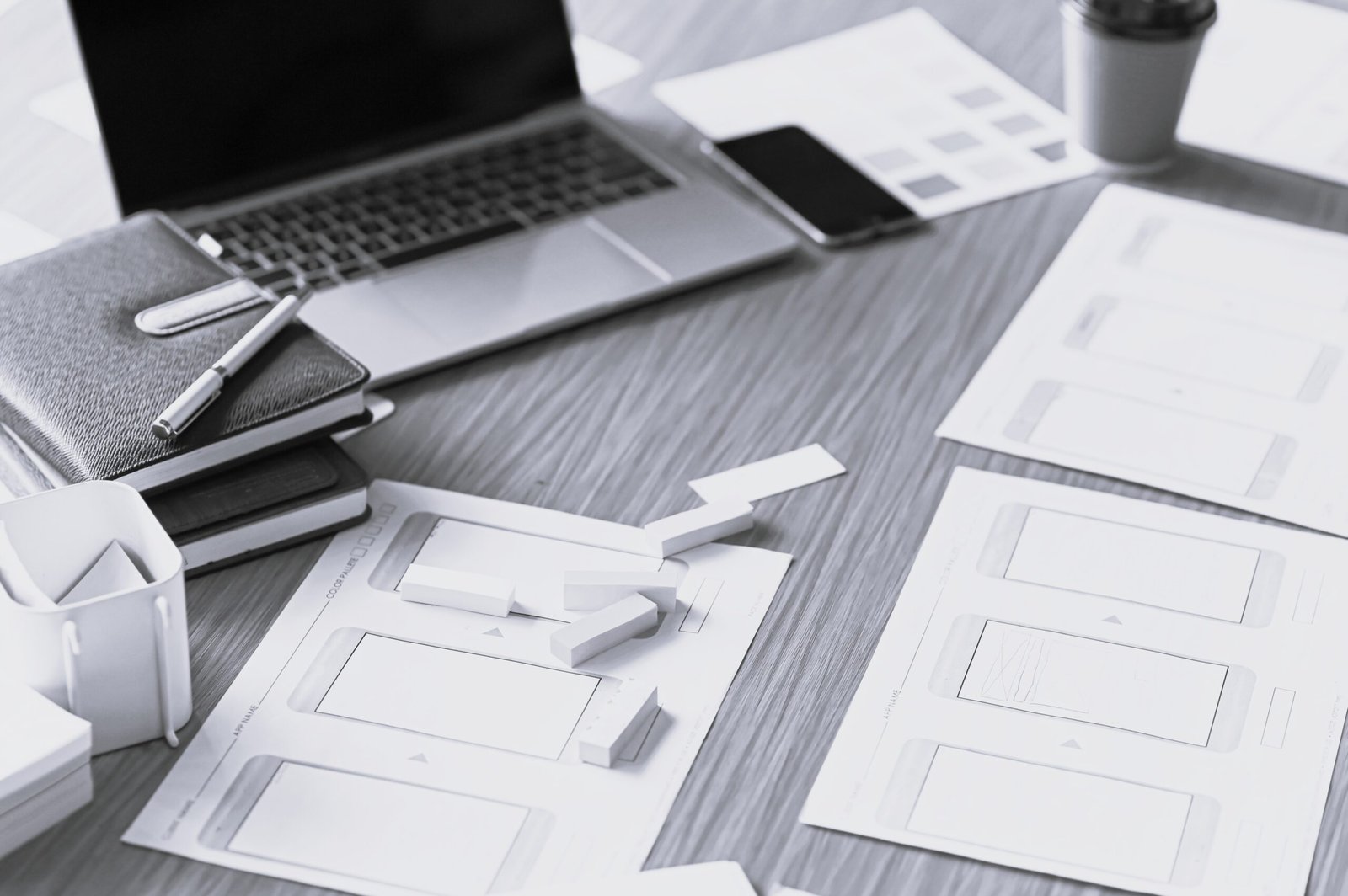 Designer desk space for designers. Color charts, model phones and tablet.